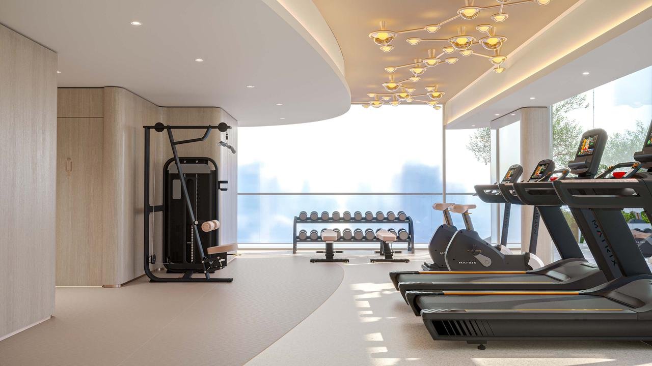 Salle de sport équipée avec vue panoramique au projet Cybel by Wadan à Dubai Land Residence Complex