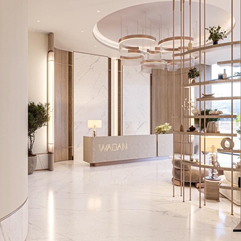 Lobby lumineux et moderne du projet Cybel by Wadan à DubaiLand Residence Complex avec réception et design contemporain