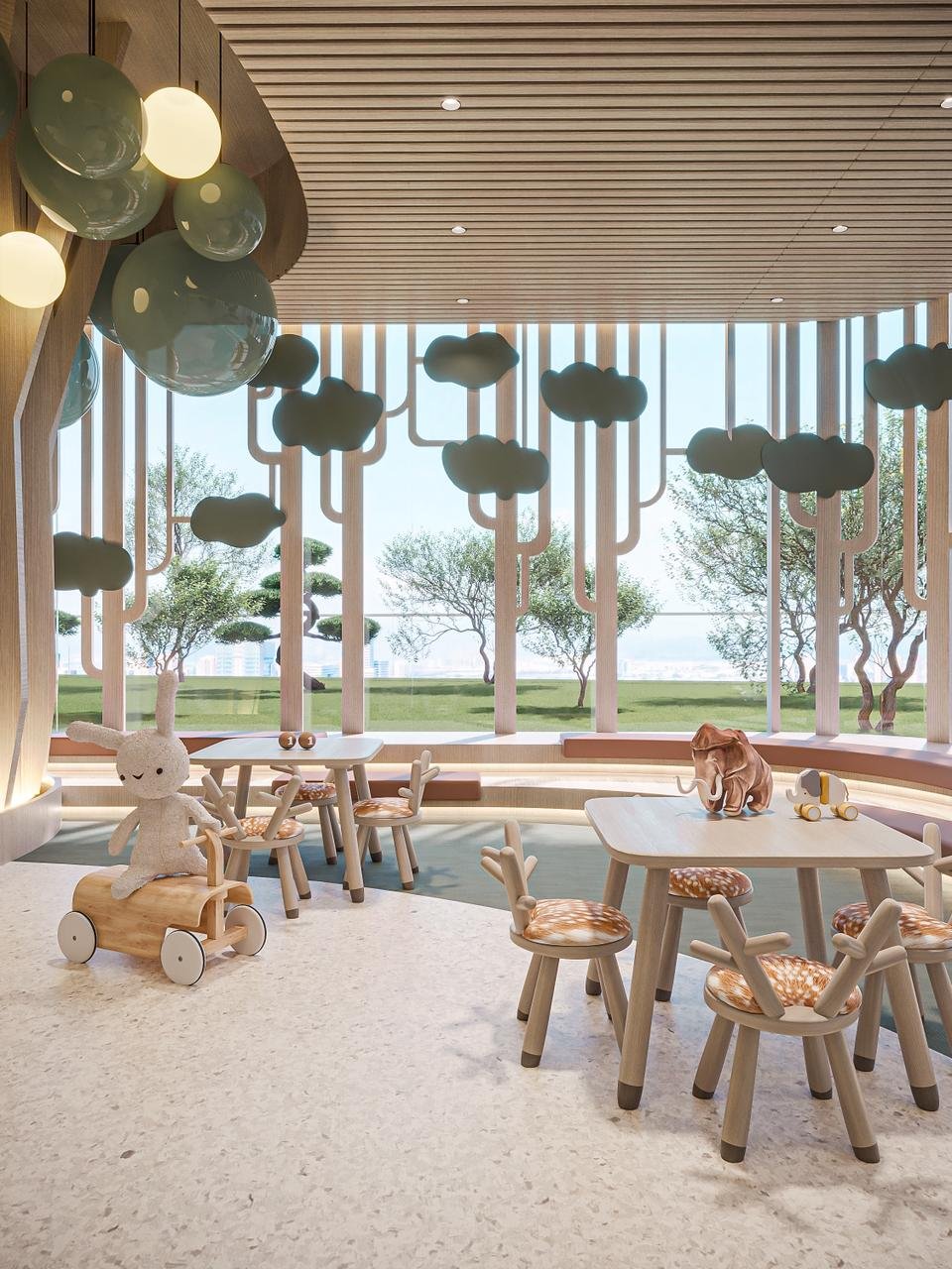 Espace ludique intérieur pour enfants au projet Cybel by Wadan avec mobilier en bois et vue sur les jardins